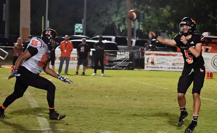 Lake Wales quarterback Brycen Levidiotis gets off a pass during a Class 3S playoff game against Leesburg.